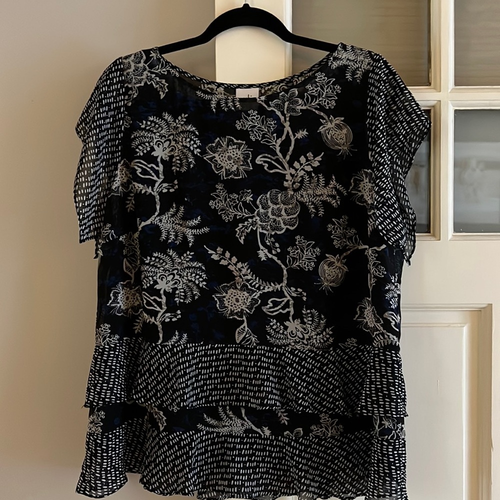 Like new Cabi top with attached cami, hemline appears to be layered